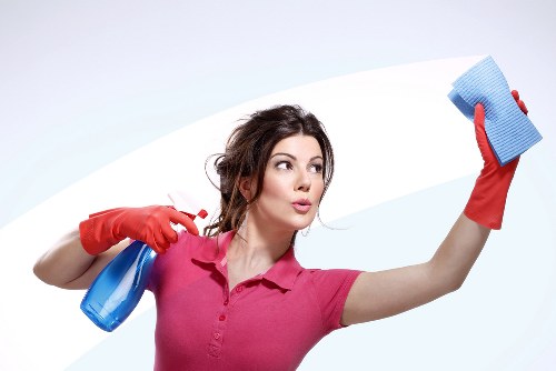 Cleaning dirt and weather staining from a commercial building facade